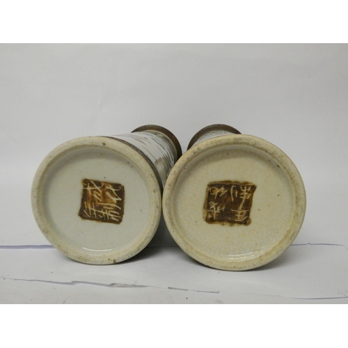 203 - A pair of Japanese crackle ware cylindrical vases, character marks on the base, height 31cms tall