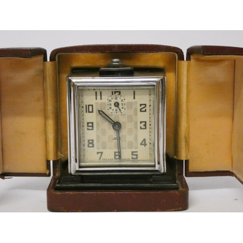 225 - An Art Deco Jaz travelling clock in fitted leather case