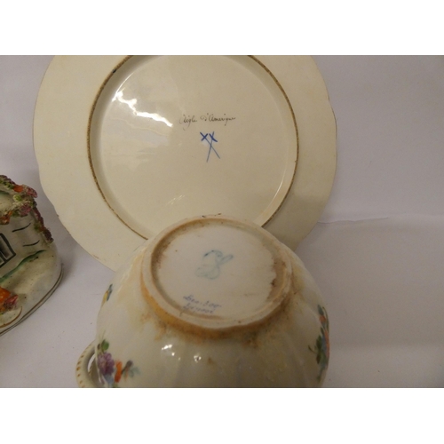 232 - A bird decorated French porcelain plate, two Staffordshire pastille burners and a Dresden twin handl... 