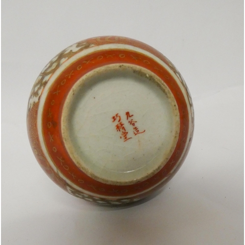 243 - A Japanese Satsuma narrow necked vase, character marks on base, 15cms tall