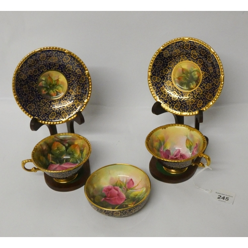 245 - Paragon - hand painted pair of cabinet cups and saucers painted with roses by F Wright and a pin dis... 