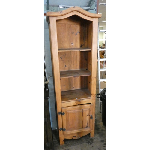 133 - A pine open shelf unit with cupboard under, 22