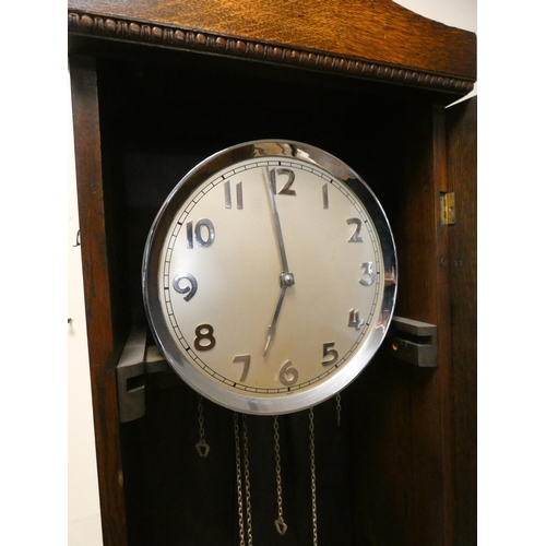 222 - An Art Deco oak cased long case clock with chrome decorative weights