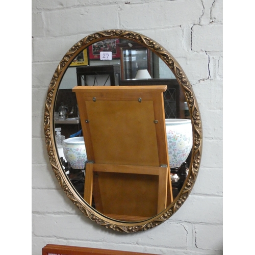 27 - A pine framed cheval style dressing mirror and an oval gilt wall mirror