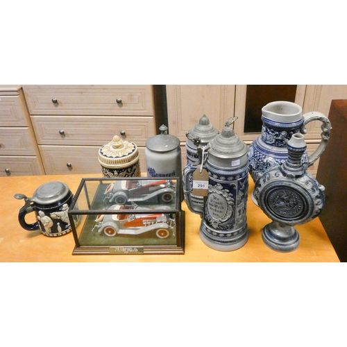 291 - Two German salt glazed tankards, a jug and a vase, Model car in case, German lidded tankard etc, and... 