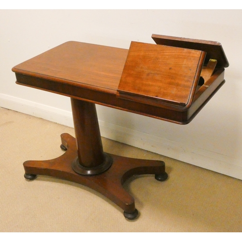 329 - A Victorian mahogany over bed table with reading slope standing on a pillar and platform base