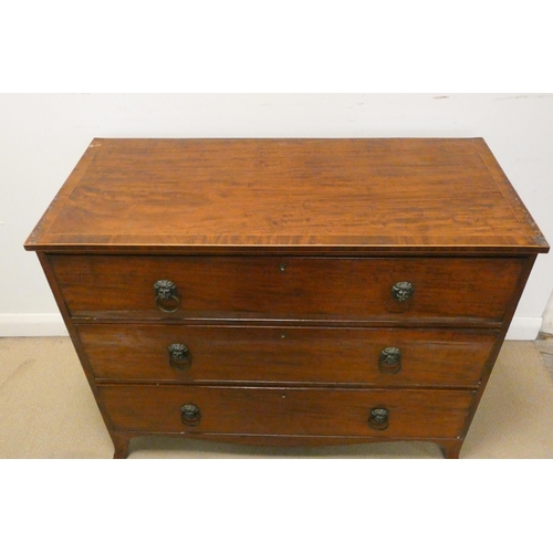 347 - A Georgian mahogany cross banded chest of three long drawers on splayed bracket feet with lion mask ... 