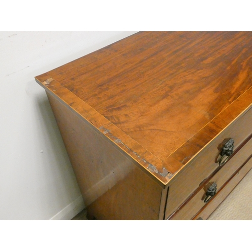 347 - A Georgian mahogany cross banded chest of three long drawers on splayed bracket feet with lion mask ... 