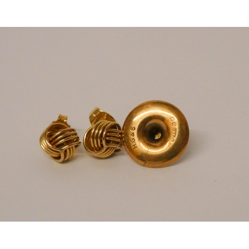 424 - A pair of 9ct gold knot design earrings and a gold shirt stud - 3.2g