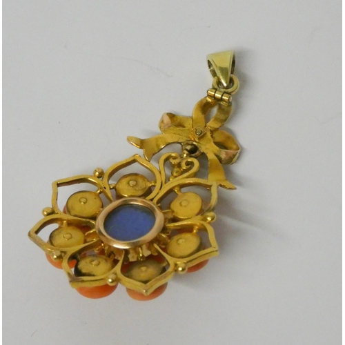 439 - 19th century coral pendant, the coral cabochons set in a floral design suspended from a ribbon bow l... 