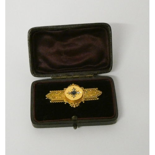 448 - A 15ct gold sapphire and diamond bar brooch, hallmarked, in fitted leather box. Gross wt 5.2g