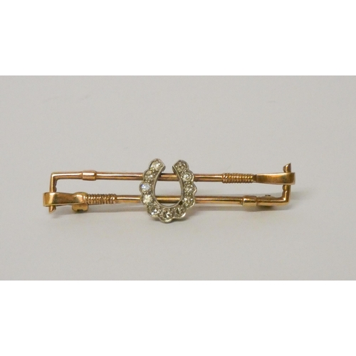 449 - A diamond set horseshoe and hunting whip design bar brooch, gross weight 3.7g