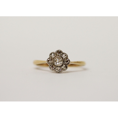 453 - An Edwardian diamond flower cluster ring, on 18ct gold and platinum setting, ring size N, gross weig... 