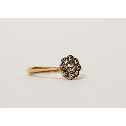 453 - An Edwardian diamond flower cluster ring, on 18ct gold and platinum setting, ring size N, gross weig... 