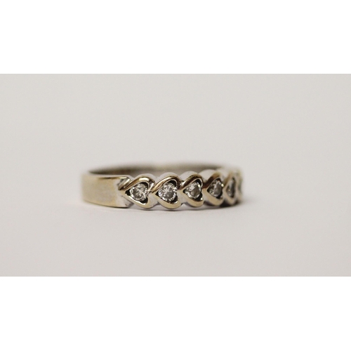 474 - An 18ct gold diamond set half hoop eternity ring, the brilliant cut diamonds in heart shaped setting... 