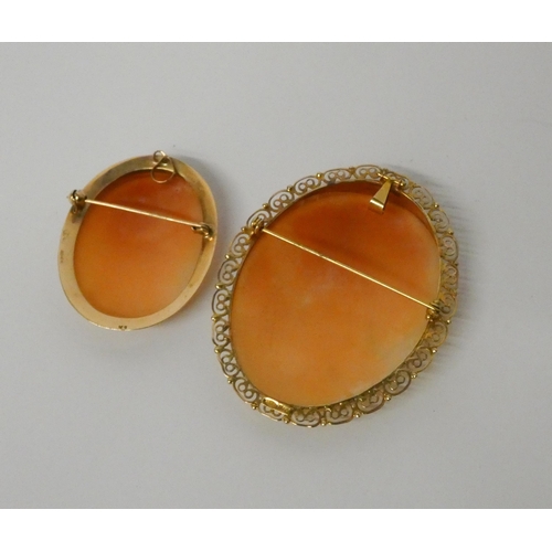 479 - A large oval carved shell cameo in 9ct gold hallmarked frame with pendant and brooch fitting and a s... 