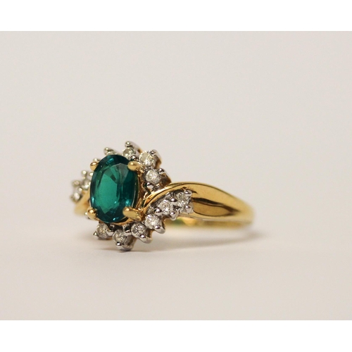 488 - An 18ct gold emerald and diamond oval cluster ring, on hallmarked yellow gold band, ring size M, gro... 