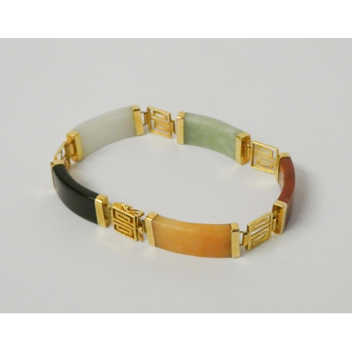 491 - A multi coloured jade panel bracelet with 14ct yellow gold fittings.