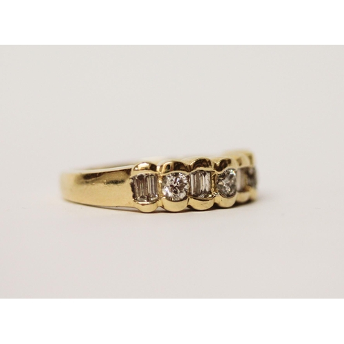 501 - A diamond half hoop ring, set alternate brilliant and baguette cut diamonds, in 14ct yellow gold, ri... 