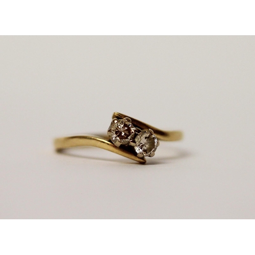 518 - A two stone diamond ring, on 18ct yellow gold hallmarked band, ring size N, gross wt 2.9g