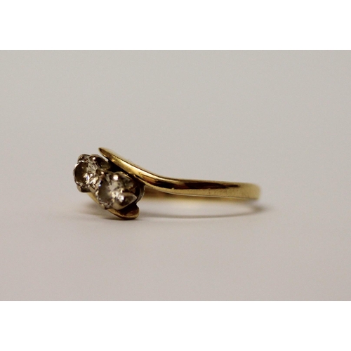 518 - A two stone diamond ring, on 18ct yellow gold hallmarked band, ring size N, gross wt 2.9g