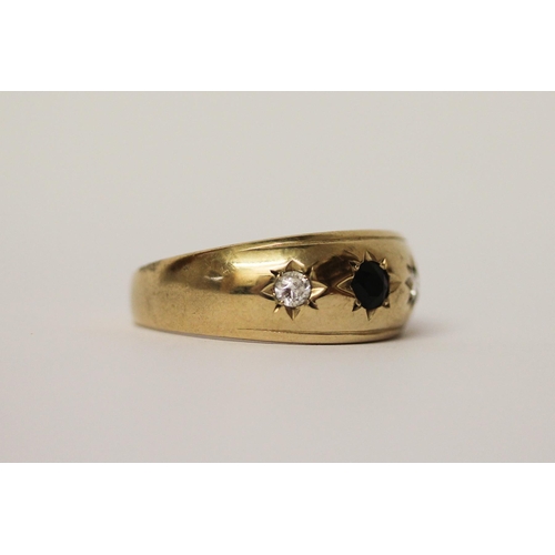 519 - A gents three stone gypsy ring, on 9ct gold band, ring size Y, gross weight 4.3g