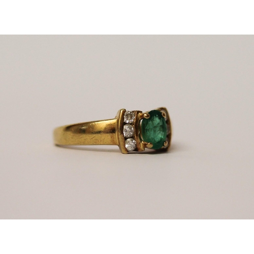 520 - An 18ct yellow gold emerald and diamond ring, hallmarked band, ring size K, weight 3.3g