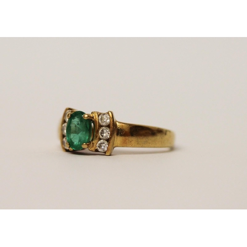 520 - An 18ct yellow gold emerald and diamond ring, hallmarked band, ring size K, weight 3.3g