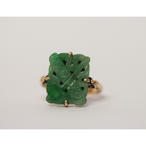 525 - A carved jade panel ring, on 14ct rose gold band. Ring size Q, gross weight 3.8g, - shank has been c... 