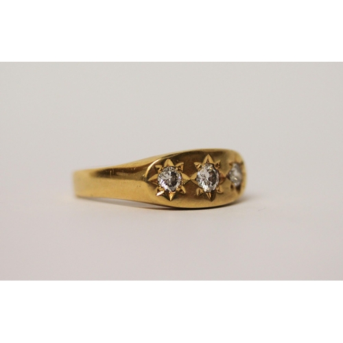 550 - A three stone diamond gypsy ring, in 18ct yellow gold, hallmarked, ring size Q, gross weight 7.6g