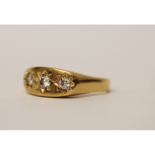 550 - A three stone diamond gypsy ring, in 18ct yellow gold, hallmarked, ring size Q, gross weight 7.6g