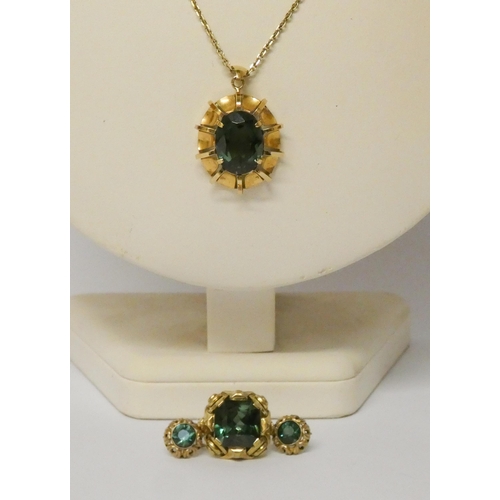 487 - Green tourmaline suite of jewellery - comprising a large rectangular pendant with 14ct gold chain, d... 