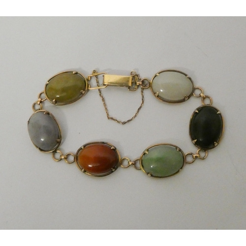 489 - A 14ct gold bracelet, cage set with assorted hardstones, with box clasp and safety chain, marked 14K... 