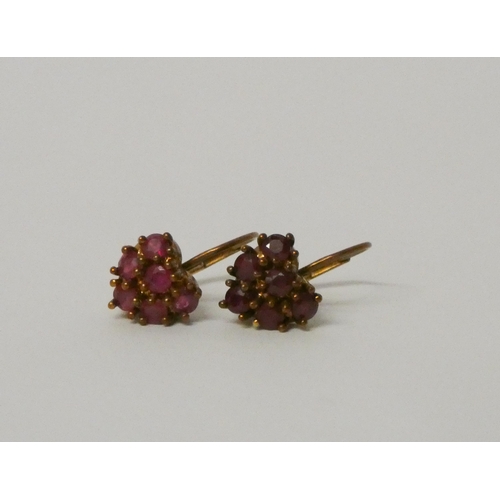 490 - A pair of 9ct gold and ruby heart shaped drop earrings.