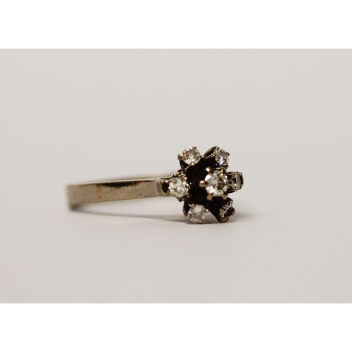 504 - Vintage diamond cluster ring, the brilliant cut diamonds claw set in a floral design on a white gold... 