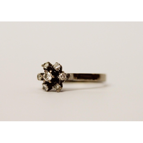 504 - Vintage diamond cluster ring, the brilliant cut diamonds claw set in a floral design on a white gold... 