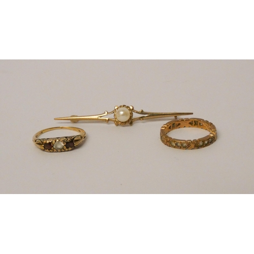 505 - A 9ct gold stone set eternity ring, garnet set 9ct gold ring and 9ct gold bar brooch set with a cult... 