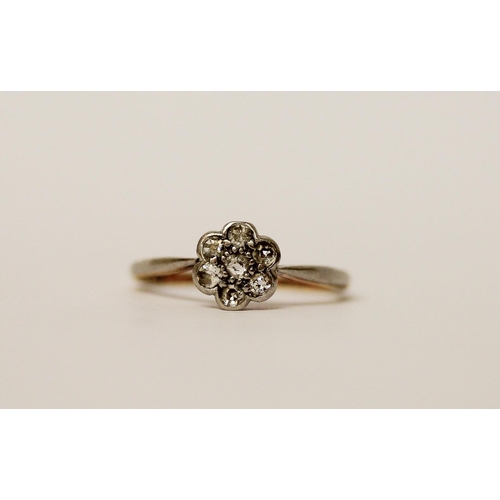 509 - A vintage diamond daisy flower cluster ring in platinum setting on a 18ct gold band, ring size K, gr... 