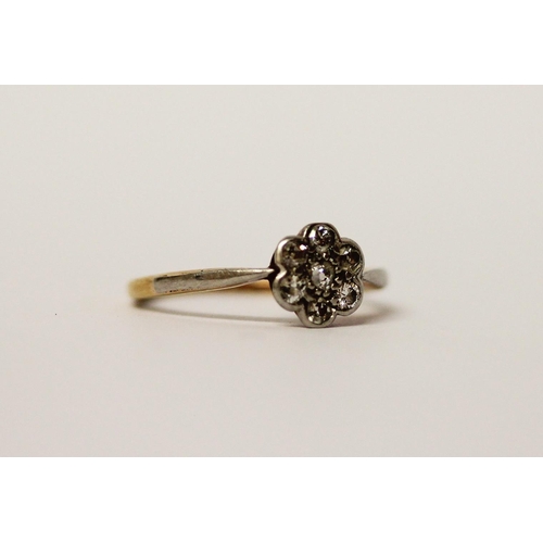 509 - A vintage diamond daisy flower cluster ring in platinum setting on a 18ct gold band, ring size K, gr... 