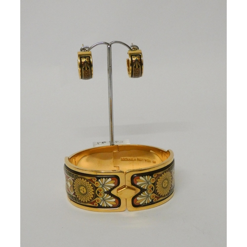 511 - An enamel hinged bangle by Michaela Frey, the 23mm wide yellow metal bangle with Art Nouveau style e... 