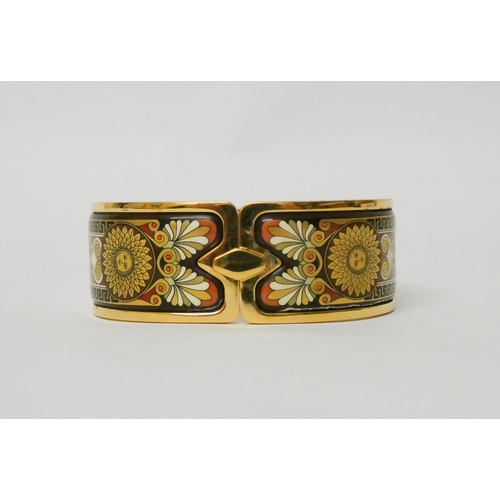 511 - An enamel hinged bangle by Michaela Frey, the 23mm wide yellow metal bangle with Art Nouveau style e... 