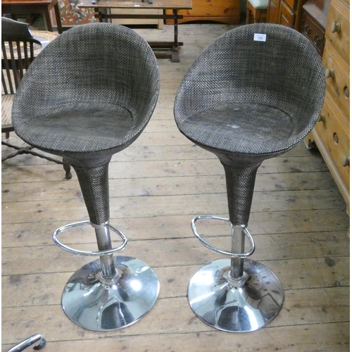 150 - A pair of adjustable high chrome framed faux cane kitchen bar stools