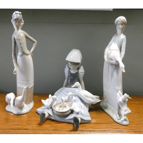 211 - Three Lladro figurines of ladies with geese