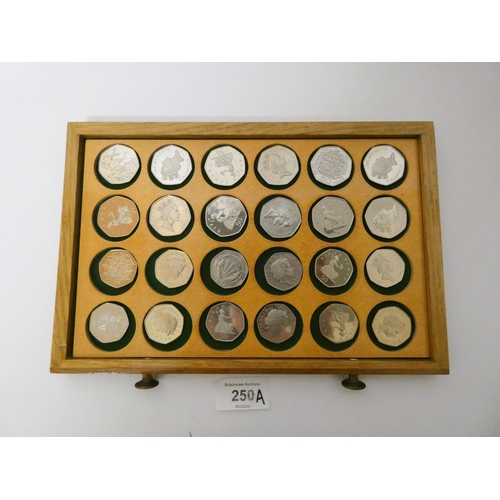 250A - An interesting collection of 50 pence coins, dates ranging from 1969 - 2010, many proof specimens, T... 