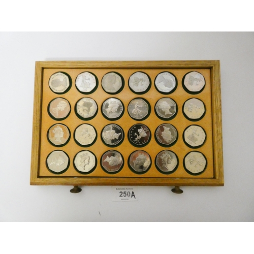 250A - An interesting collection of 50 pence coins, dates ranging from 1969 - 2010, many proof specimens, T... 