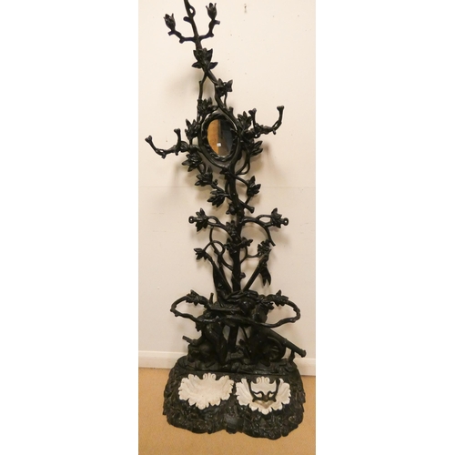 383 - A Victorian black painted cast iron tree style hall stand, with soldier figures and cannon cast on t... 