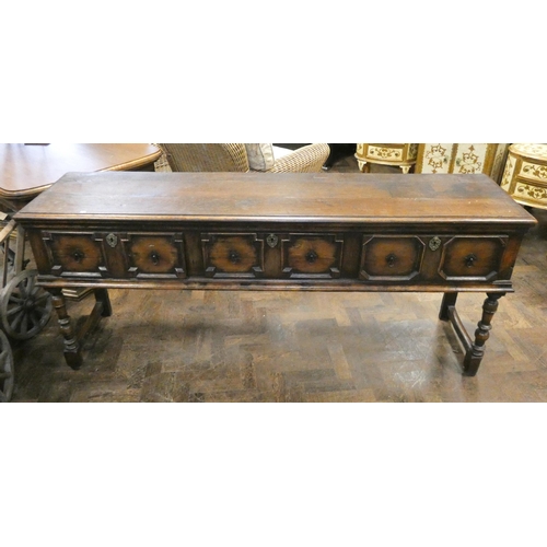 392 - Dark oak Jacobean style dresser base, fitted three fielded panel drawers. 77