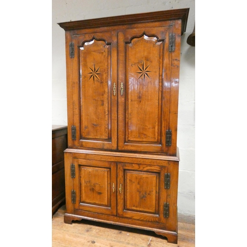 393 - Good quality antique style inlaid oak linen press style cabinet, used as a drinks cabinet, with star... 