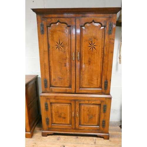 393 - Good quality antique style inlaid oak linen press style cabinet, used as a drinks cabinet, with star... 