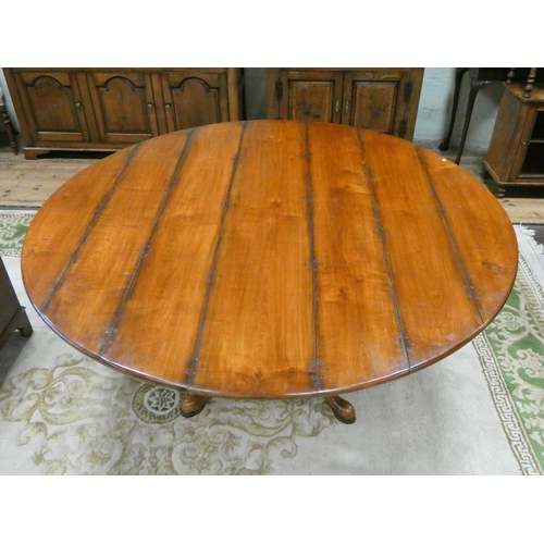 394 - Circular Georgian style cherry wood dining table on quatreform pedestal base. Top is 64